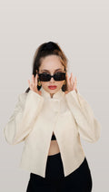 Model wearing the cream stand collar blazer, front view
