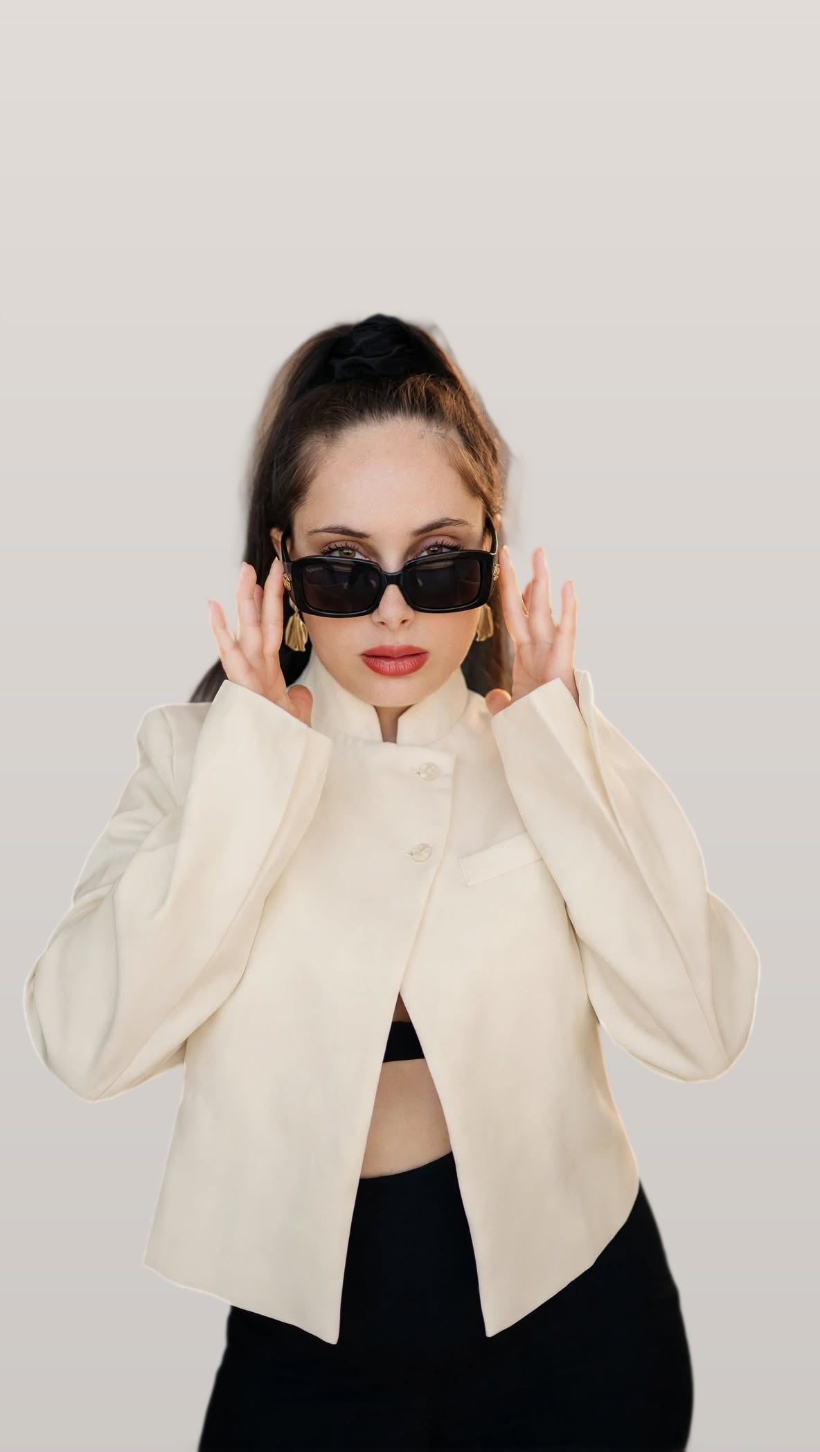 Model wearing the cream stand collar blazer, front view
